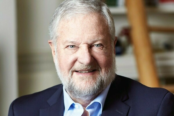 David Rockefeller Jr. waring a navy suit and light blue collared shirt